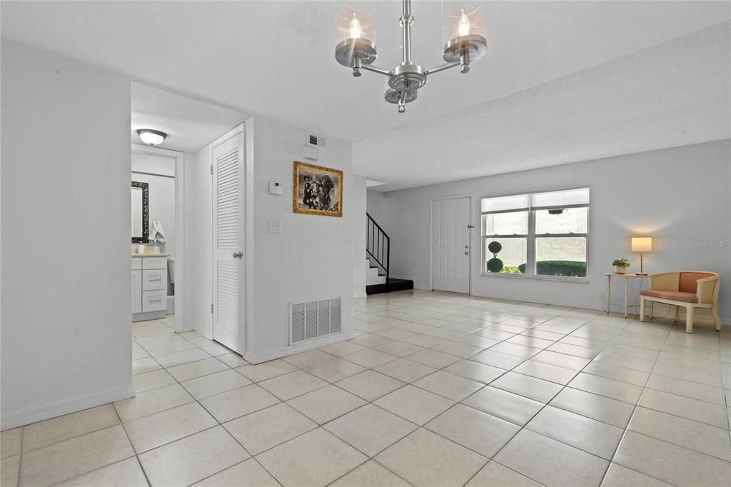 Enter to a spacious tiled great room open to the dining room