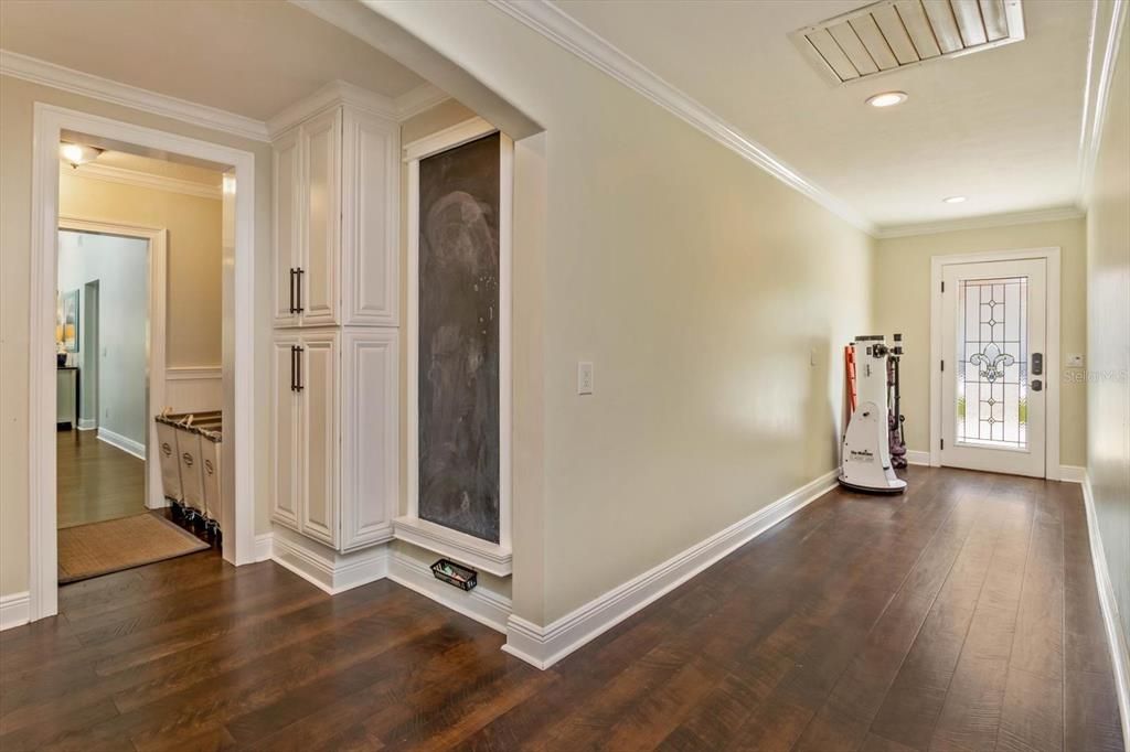 Mud room with entrance to laundry and garage
