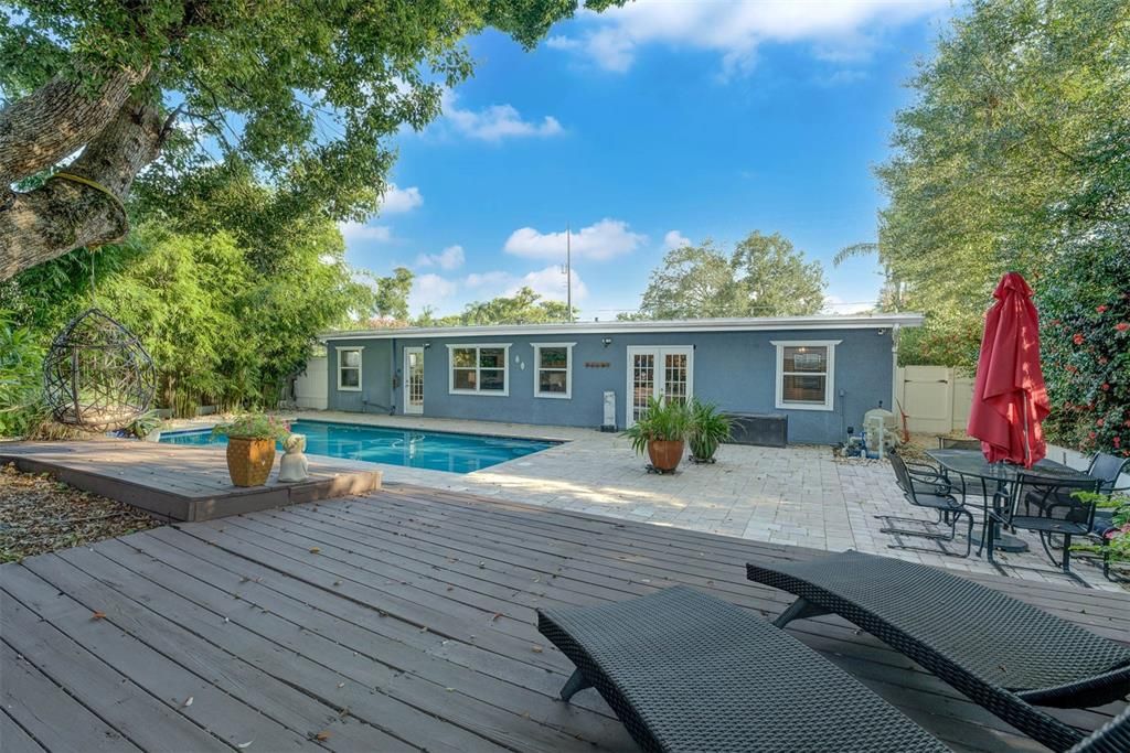 Backyard oasis with saltwater pool and paver deck