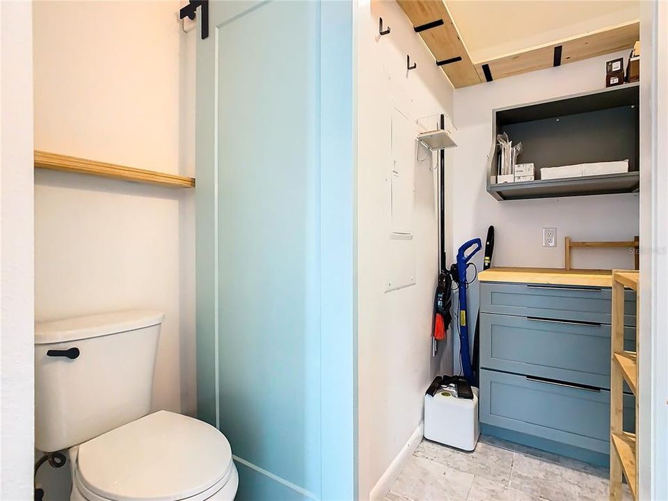 1/2 bath with separate storage room