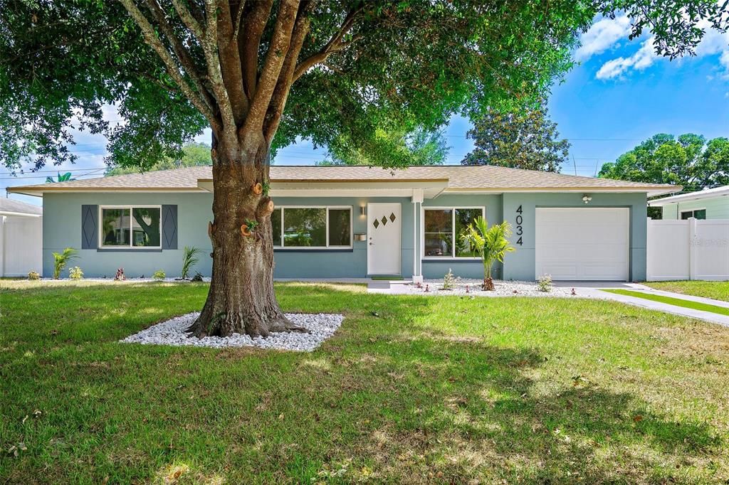 Updated home with new landscaping and new windows and new garage door