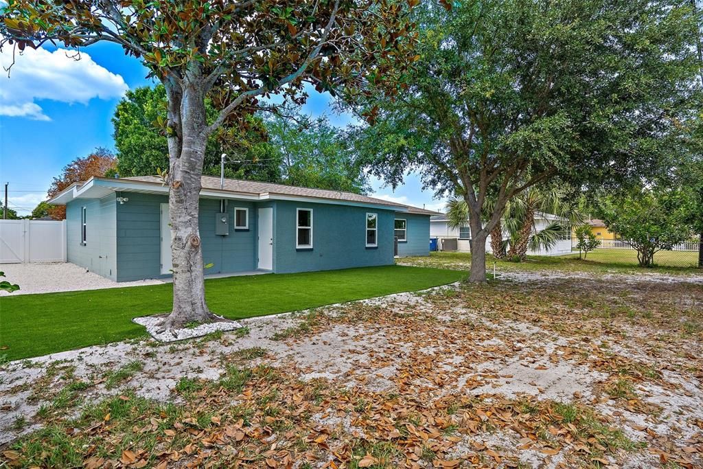 Laundry room with door to backyard off of the garage