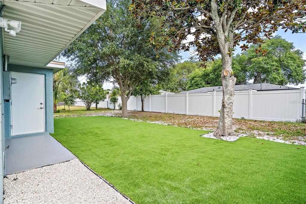 Virtual staged backyard with full sod or turff