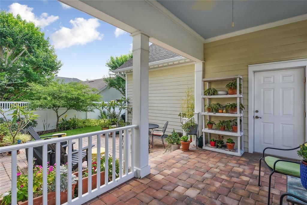 Lovely covered brick paved back porch