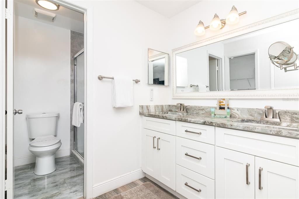 En-Suite Bathroom to King Master Bedroom Features Walk-In-Shower and Large Vanity Area