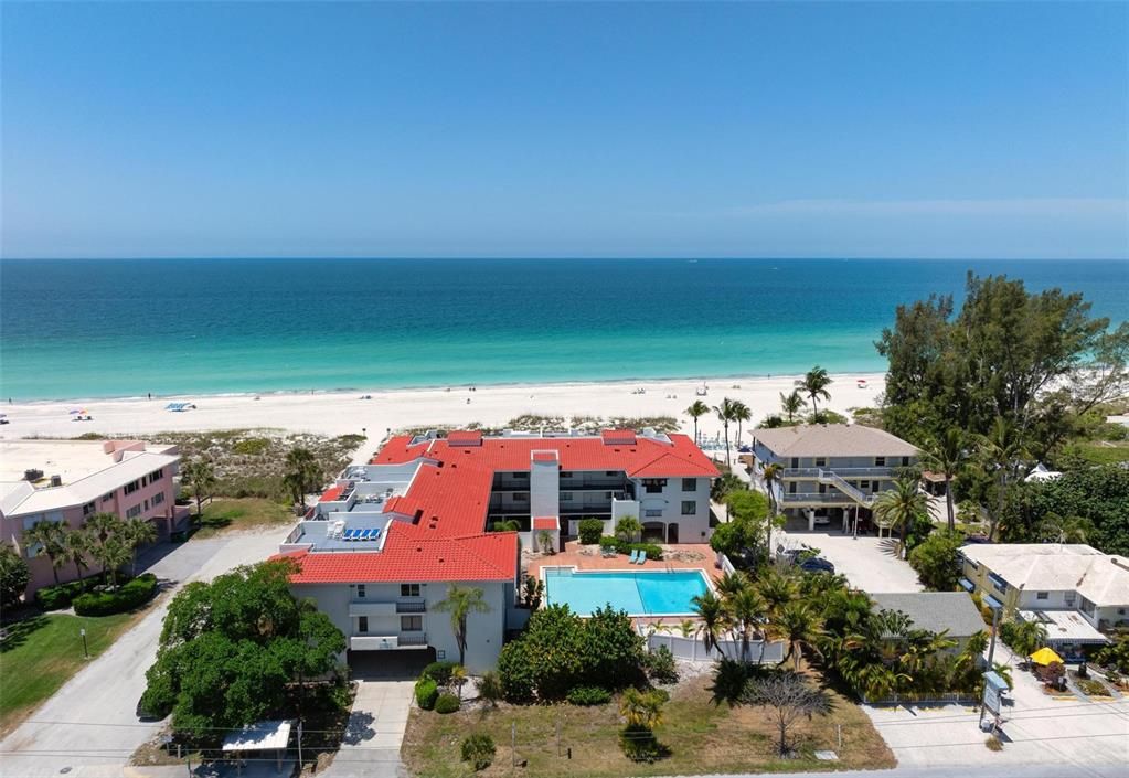 Aerial views of the gulf of Mexico, Ocean Park Terrace, under building parking and large community pool