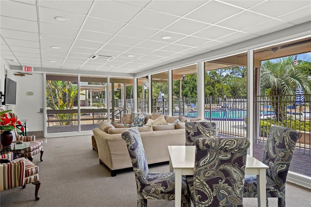 Large gathering room with view of the pools