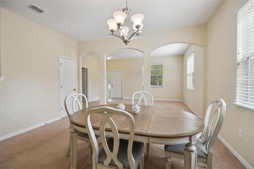 formal dining room and view of the living room