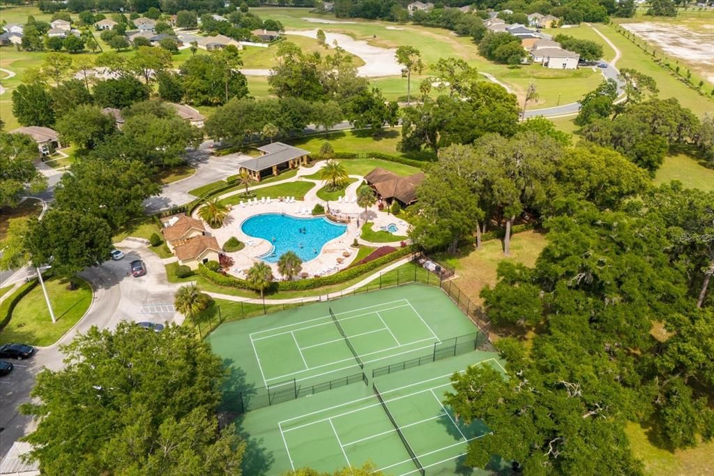 Community pool with lounge deck, tennis courts with basketball hoop, screened pavilion, and community club house with fitness center.