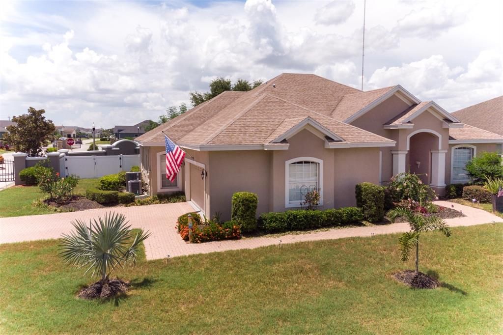 Large corner lot with easy access in and out of gated community