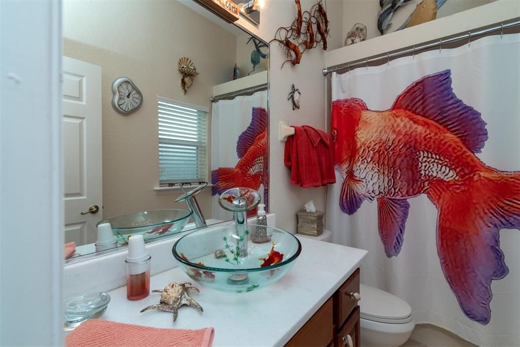 Guest bathroom with access to the pool from back door