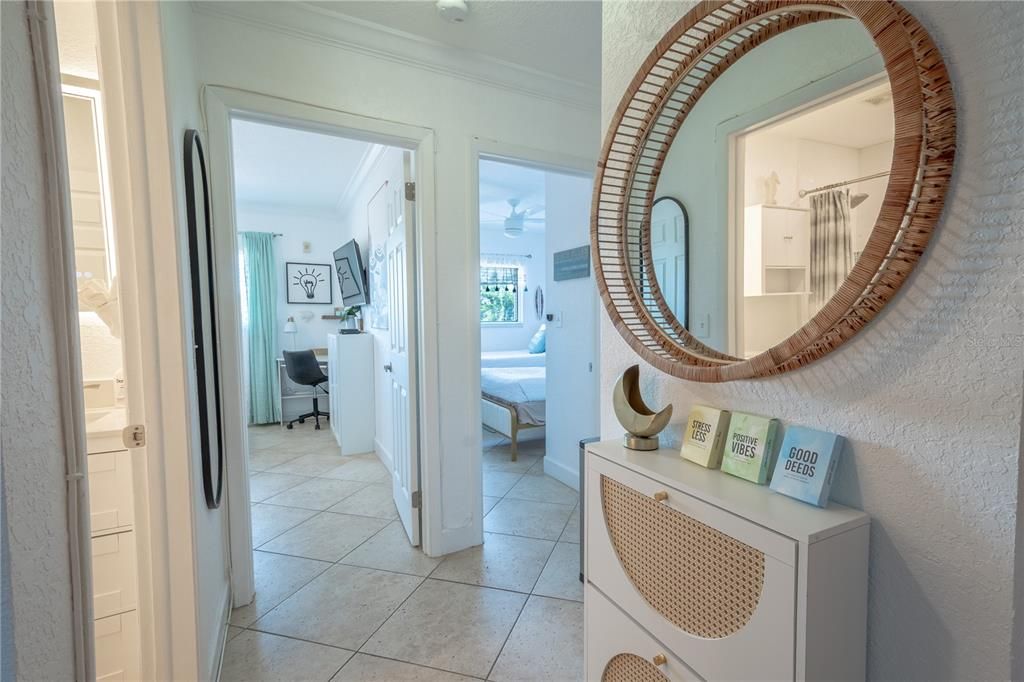 The entry features a mirrored storage cabinet to hold your keys.