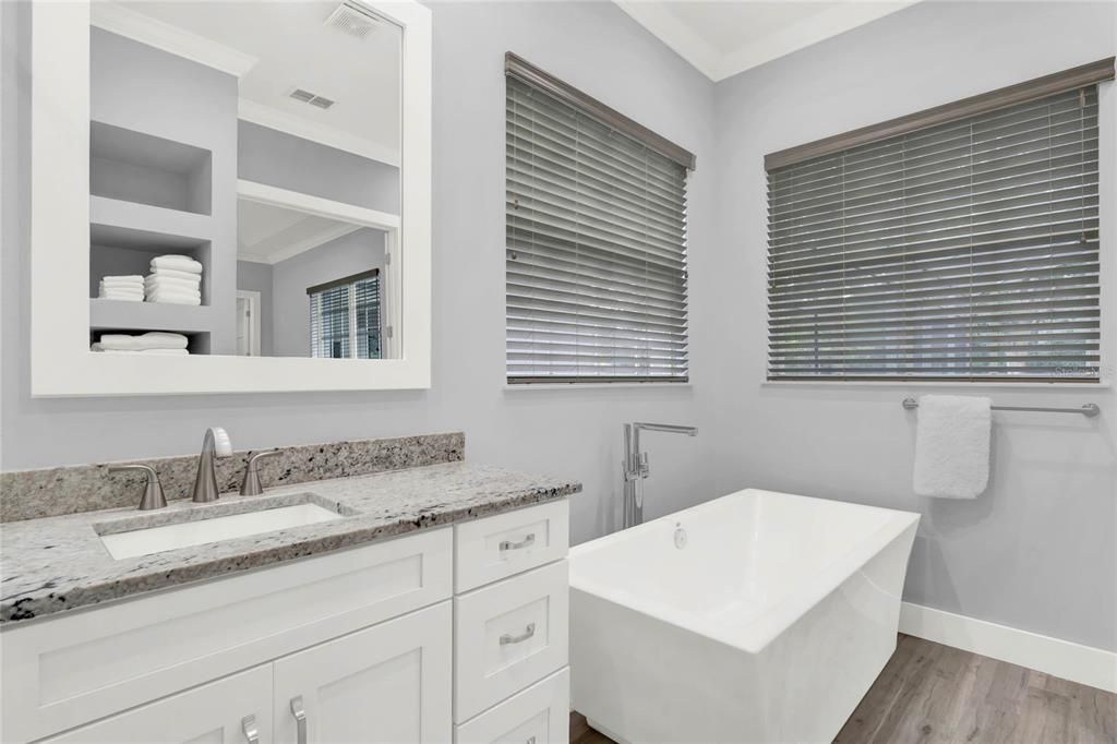 Owner's bath has large stand alone soaking tub