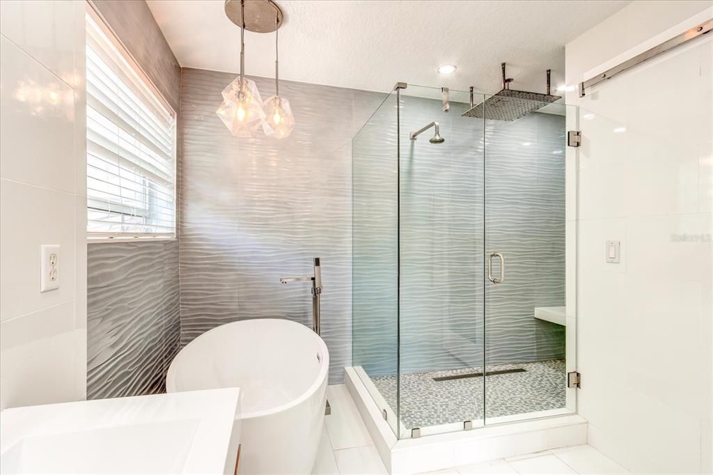 Walk-in shower with two shower-heads AND a rain shower