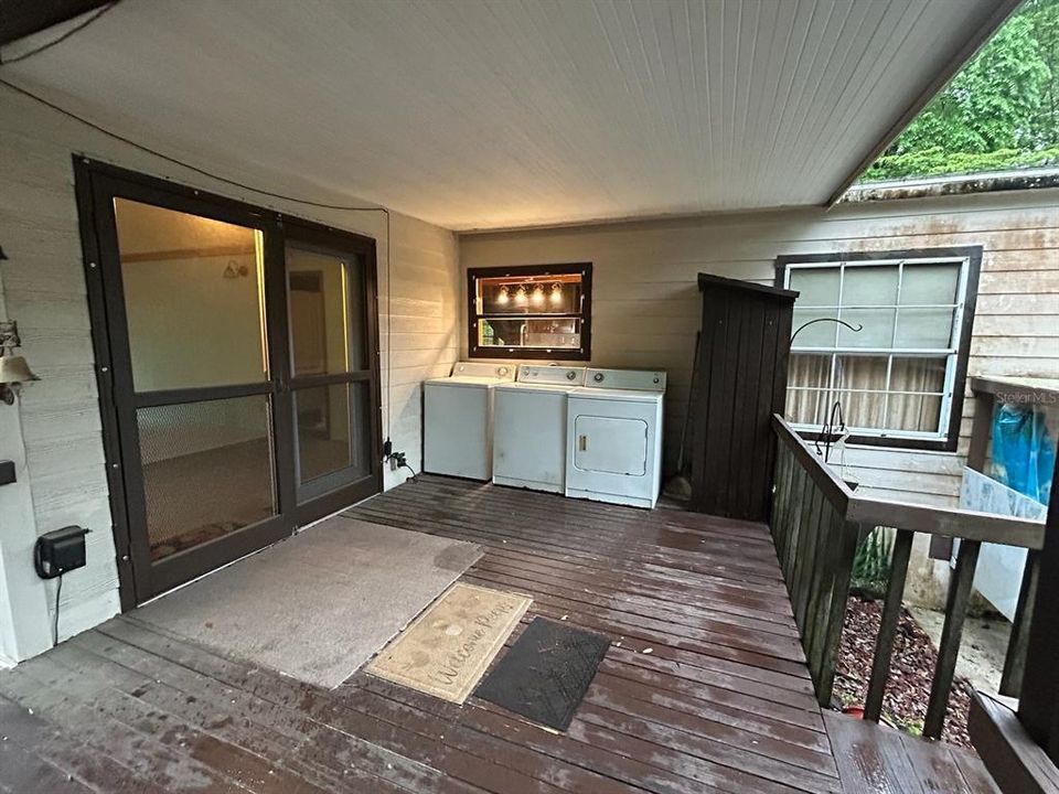 Large Covered Back Porch with Ramp to Parking