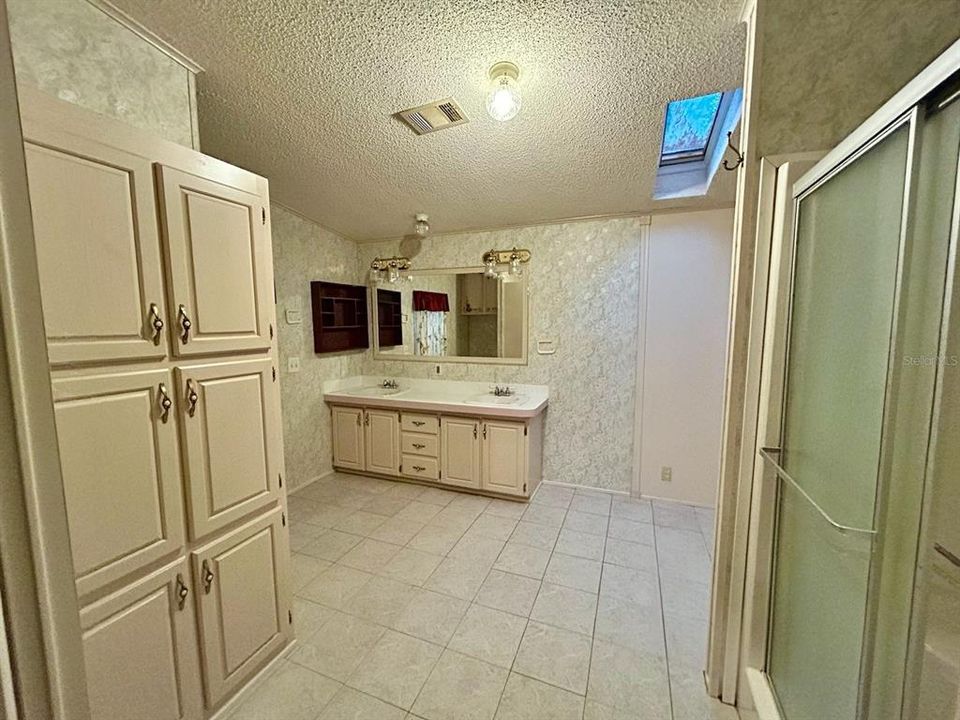 Master Bath; Lots of cabinets and storage; Large Shower; with washer and dryer hookup