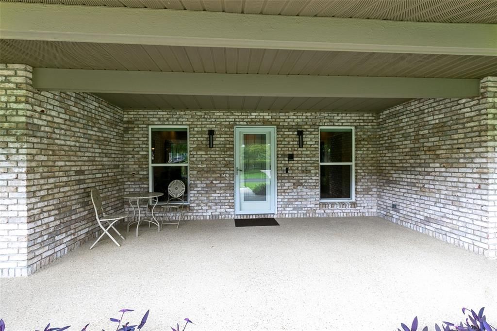 Front Covered Patio with Sundek Floor Coating and Brick Fascia