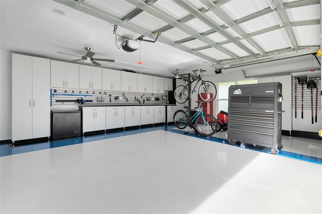 3 Car Garage with Epoxy Flooring, Cabinets and Slat Wall