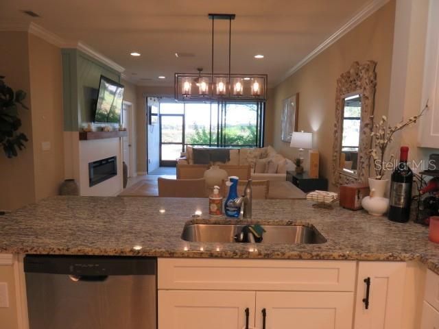 Kitchen overlooking dining area, family room and screened in lanai