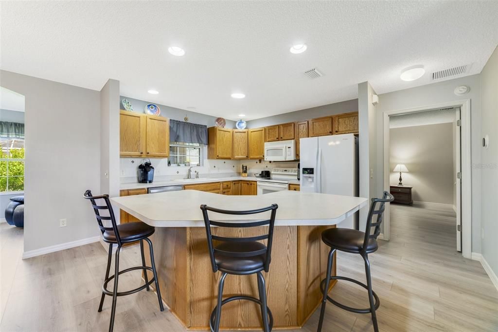 The open kitchen serves as the heart of this home, gather with family & entertain friends!