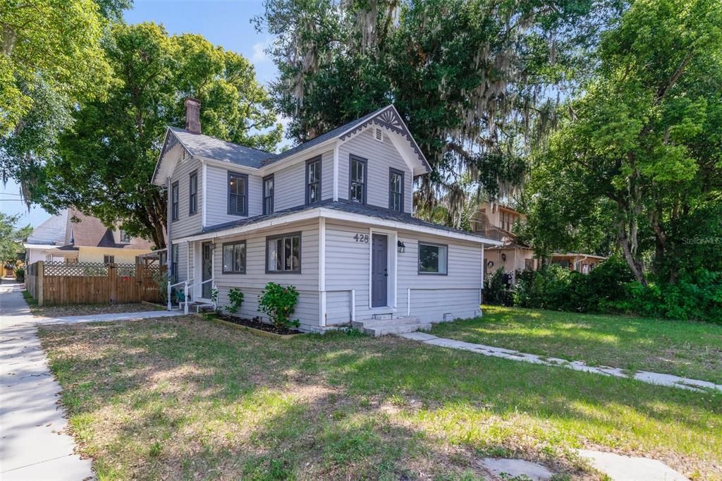 Welcome to E Orange Ave and this 4-bedroom, 3-full bath home on a spacious CORNER LOT just blocks from Lake Eustis offering the perfect blend of historic 1919 charm and modern updates!