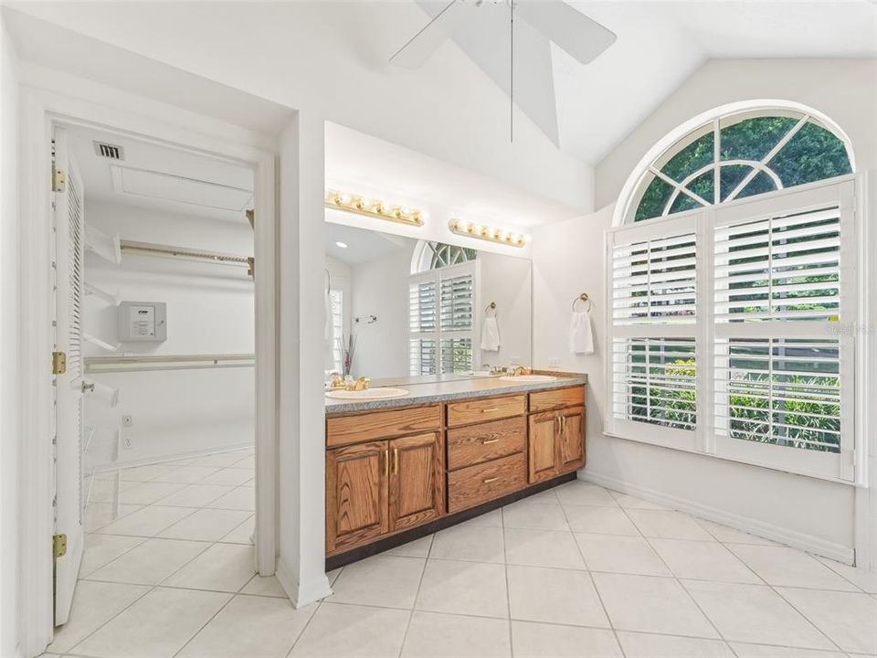 Plantation shutters and large closet are in the primary bath