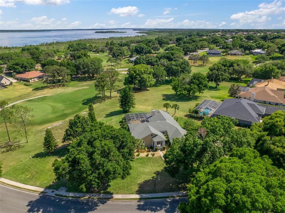 Aerial View of the home and view of Lake Griffin in background.