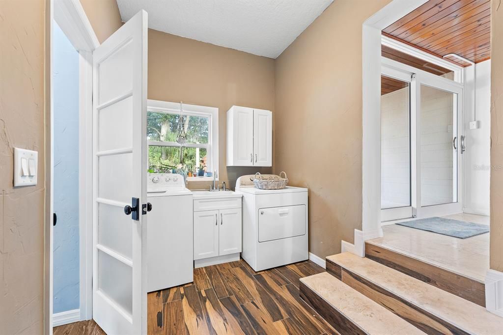 Laundry Room with utility sink and conveniently located off the Primary Suite