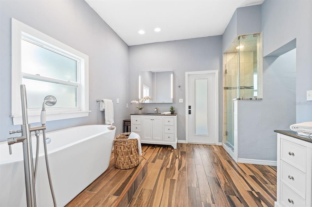 Primary Bath with dual vanities, luxurious soaking tub and walk-in shower
