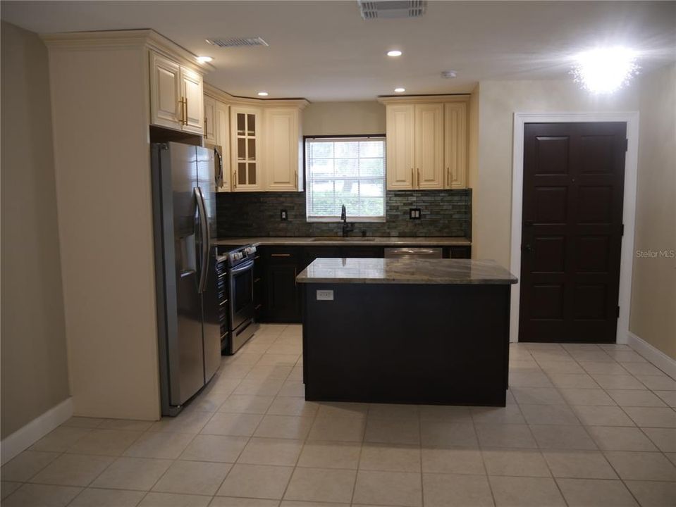 Open plan and new appliances, wood cabinets and everything else!!