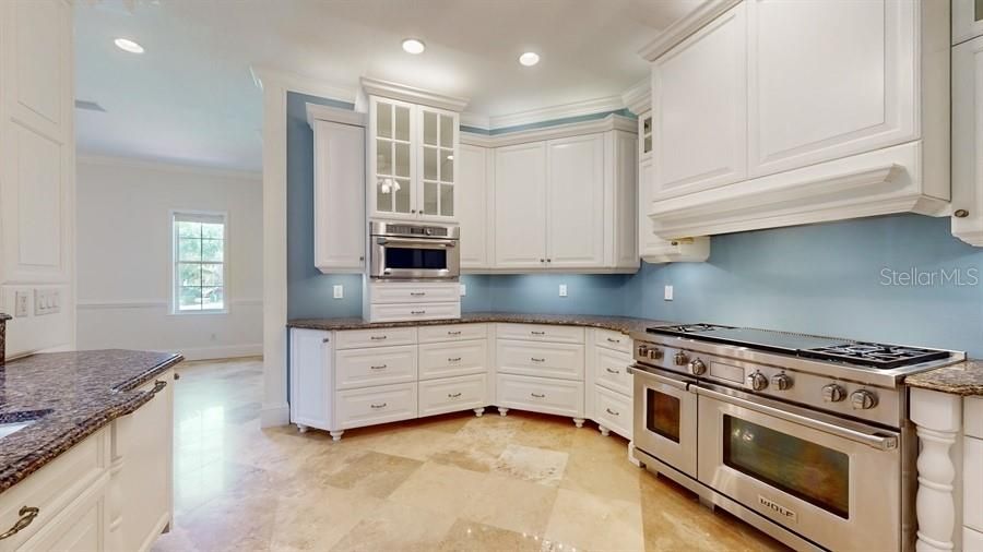 VIEWS OF KITCHEN WITH CUSTOM CABINETRY