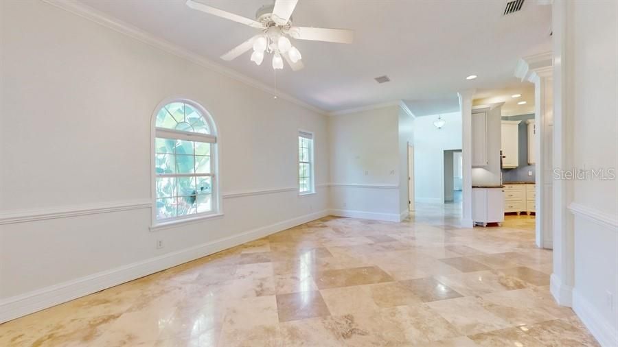 FORMAL LIVING ROOM WITH POLISHED TRAVERTINE FLOORING