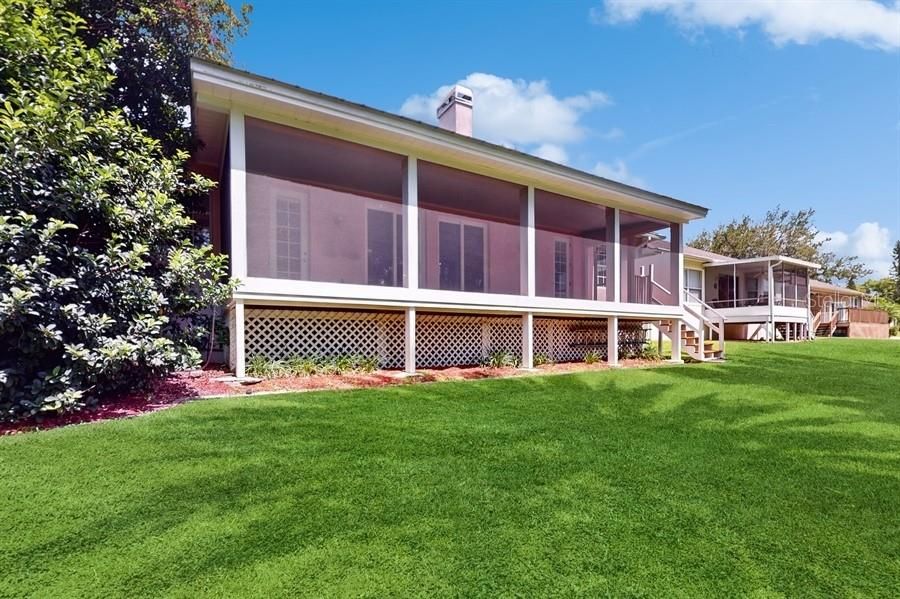 VIEWS OF SCREENED PORCH THAT OVERLOOKS CONSERVATION