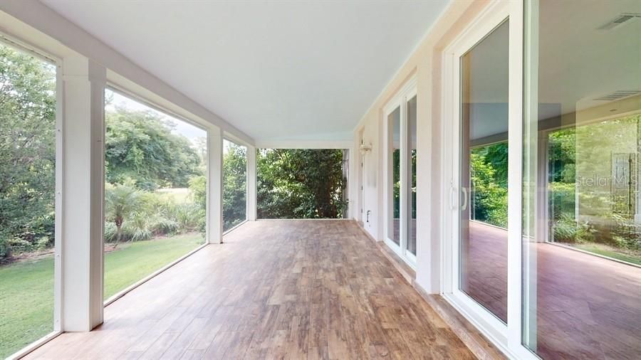 SCREENED PORCH WITH TILED FLOORING