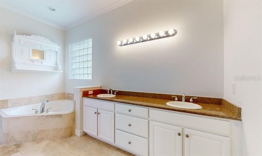 PRIMARY BATHROOM WITH DUAL SINKS AND JACUZZI TUB