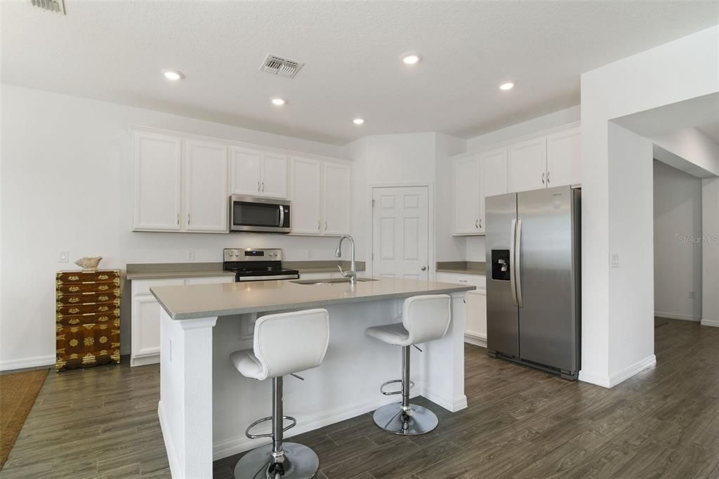 Built in 2019 this home still feels LIKE NEW as you explore the light and bright OPEN CONCEPT with TILE FLOORS in the main living areas adding the airy feel and making maintenance a breeze.