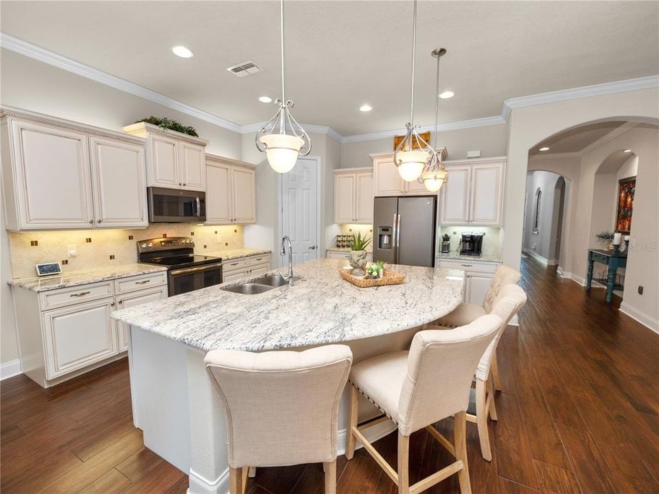 Gourmet Kitchen with Granite Counters and Breakfast Bar & Nook OPEN to Great Room