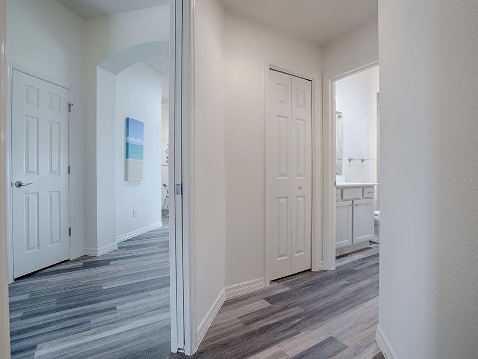 POCKET DOOR FROM THE FOYER LEADS TO THE PRIVATE GUEST SUITE WITH 2 GUEST ROOMS AND GUEST BATH.