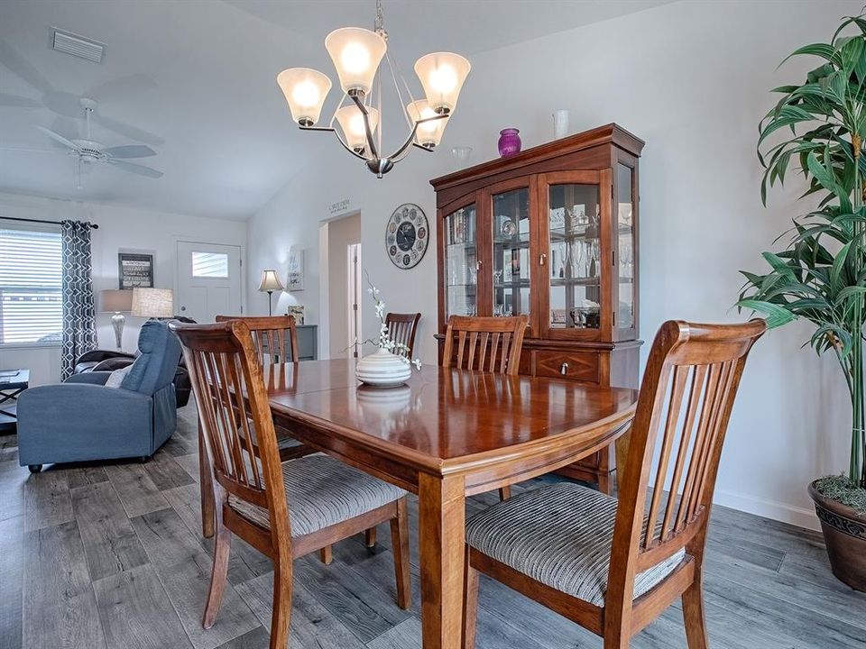 SPACIOUS DINING ROOM - THIS TABLE HAS A LEAF AND 2 MORE CHAIRS FOR FAMILY AND FRIENDS.