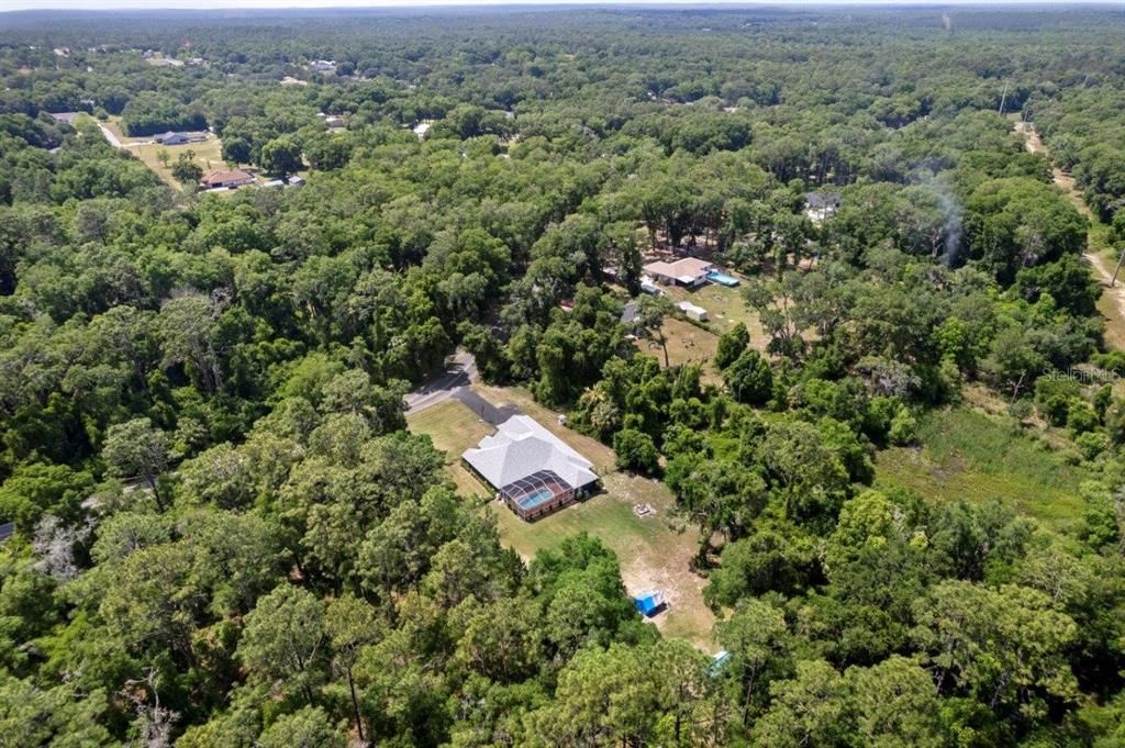 Southeastern aerial of the property showing the land and surrounding area.