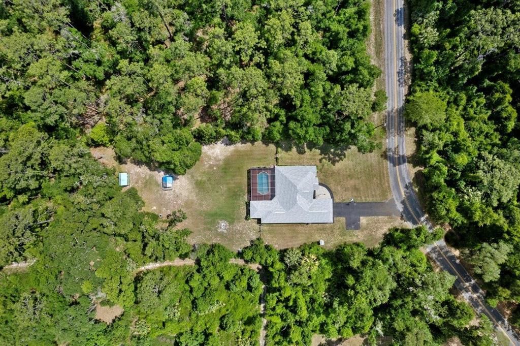 Aerial from the top of the home showing the property layout.