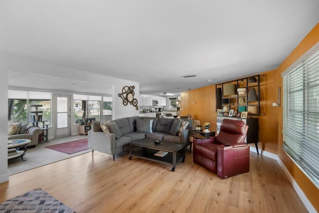 Living room featuring vinyl plank flooring.