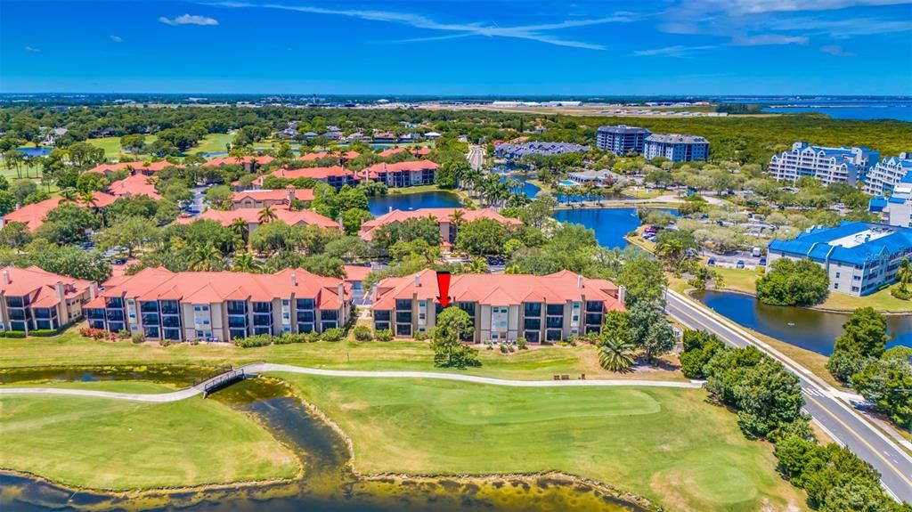 Rear aerial view, 2nd Floor Condo with Water View, overlooking Golf Course. Unit #1026. Florida Living at its finest!