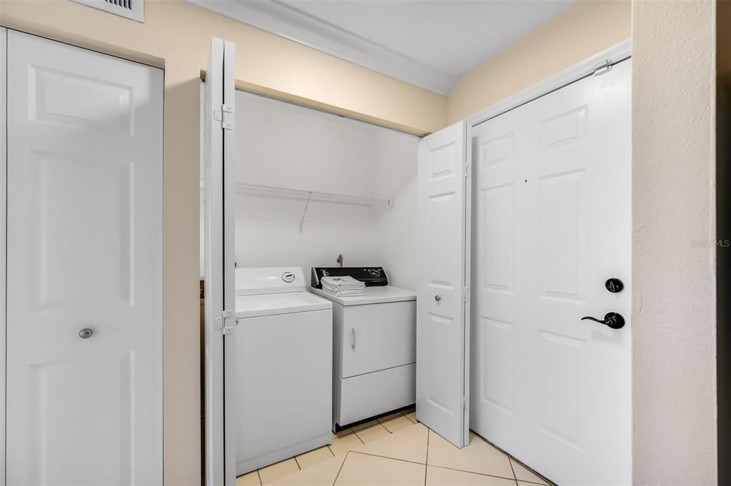 Laundry Closet with Full Size Washer and Dryer.