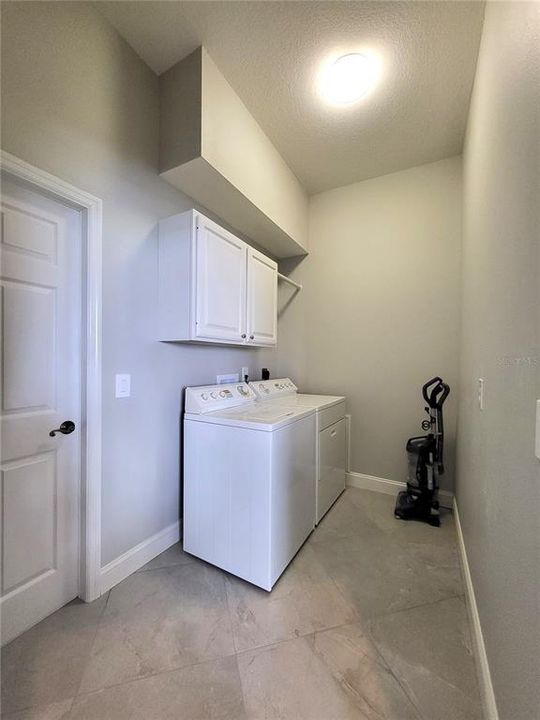 Laundry room. with cabinets.
