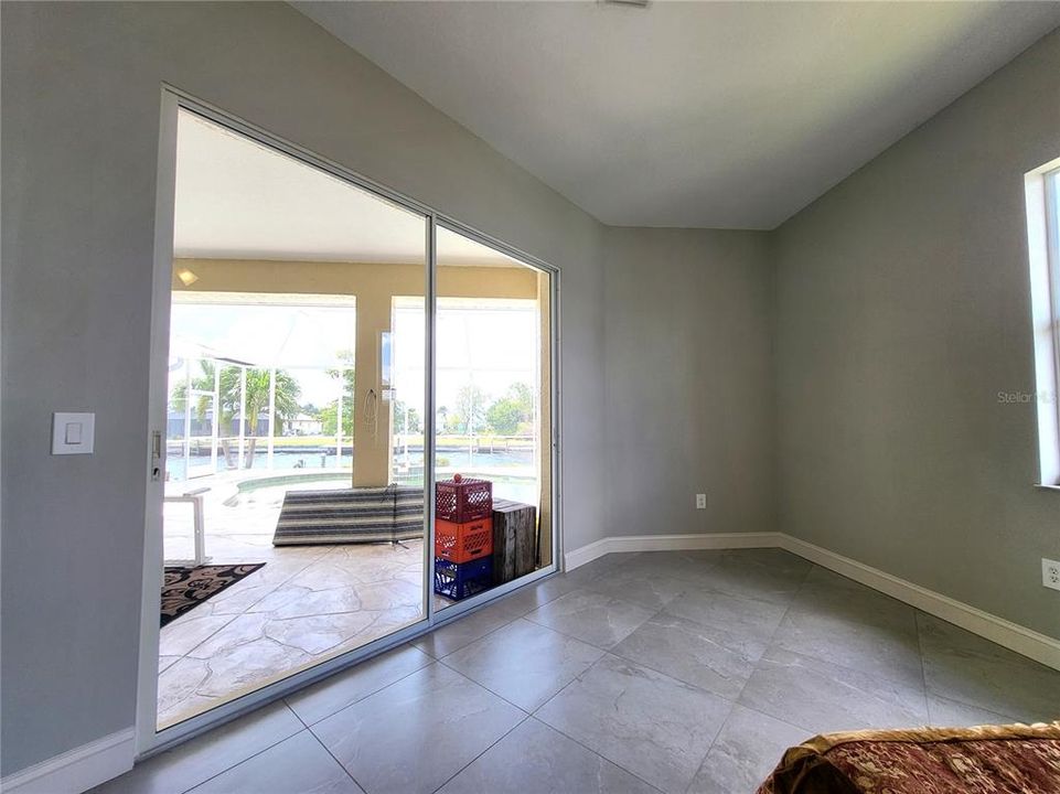 View of the pool, and room for sitting or exercise area.