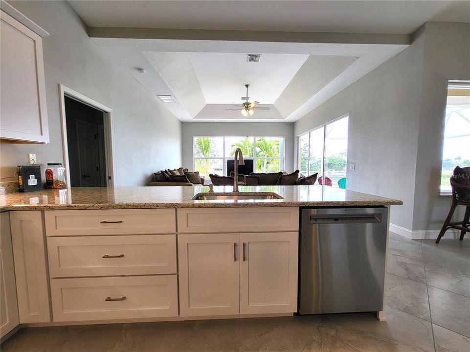 New GE stainless dishwasher, practical soft-close drawers, and accessible corner cabinets.