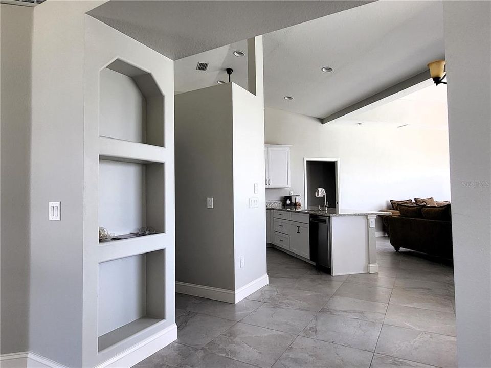 Built-in shelves in the transition space from the Great room to the kitchen and Family room.