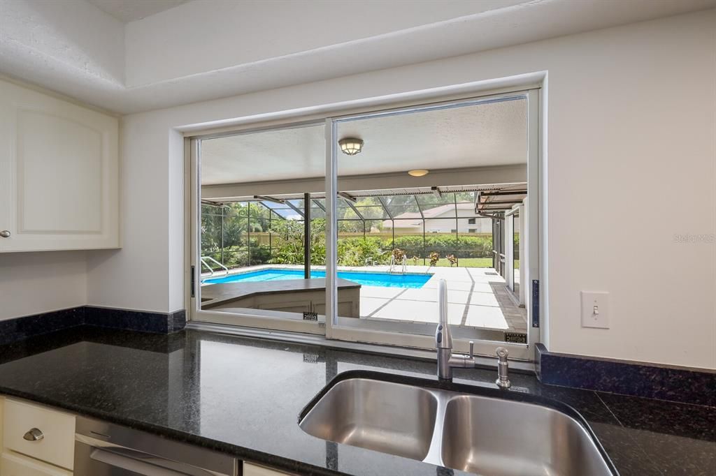 Kitchen sink with pass through window to outside entertainment area