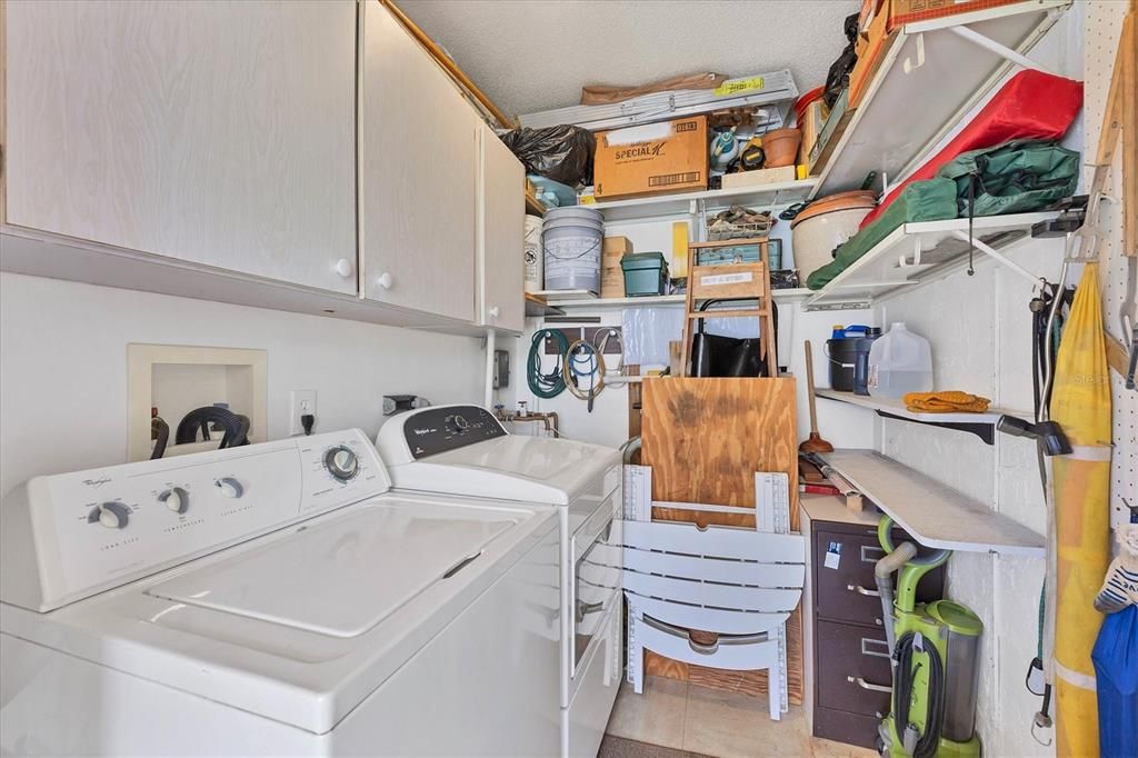 Laundry room is enclosed with storage (access off rear porch)